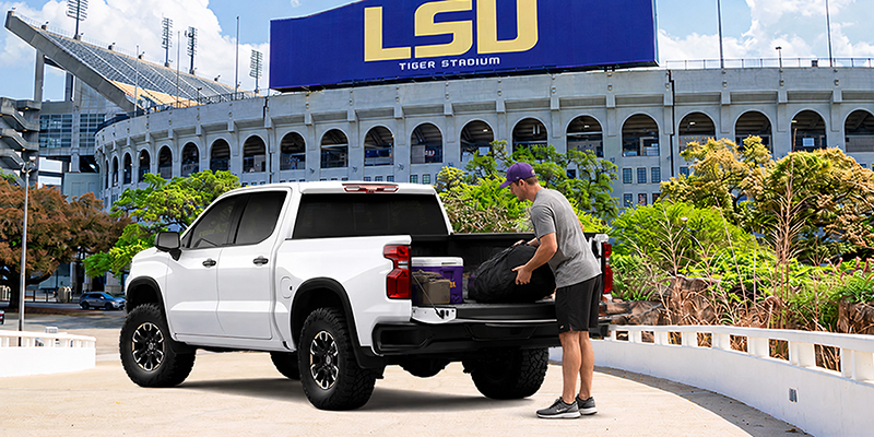 A Chevrolet Silverado 1500 parked in front of LSU's football stadium